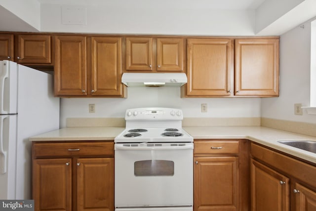 kitchen featuring sink and white appliances