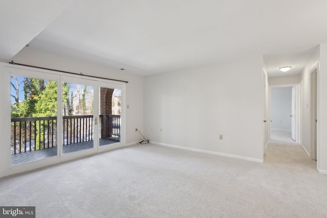 spare room with light colored carpet