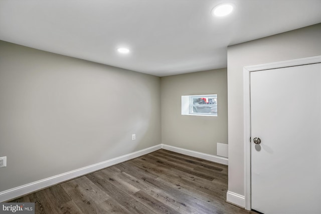 spare room with hardwood / wood-style flooring