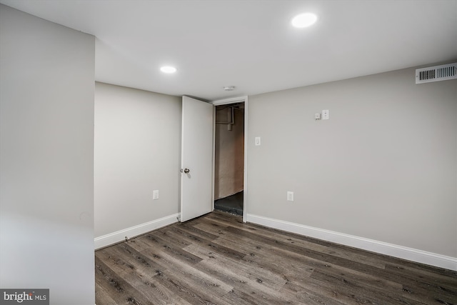 spare room featuring dark hardwood / wood-style floors