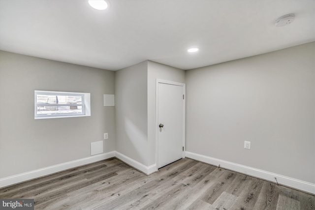 spare room with light hardwood / wood-style flooring