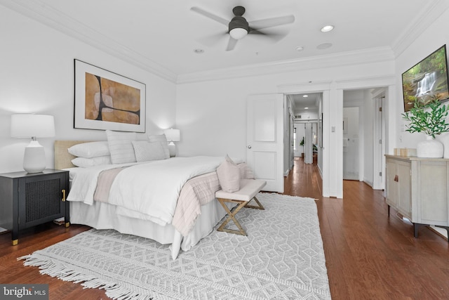 bedroom with ceiling fan, crown molding, and dark hardwood / wood-style floors