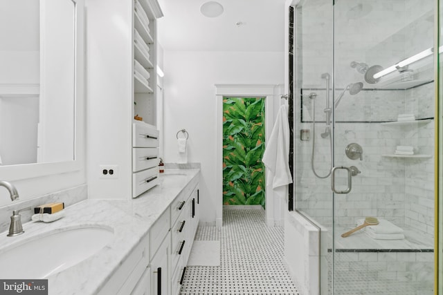 bathroom featuring an enclosed shower and vanity