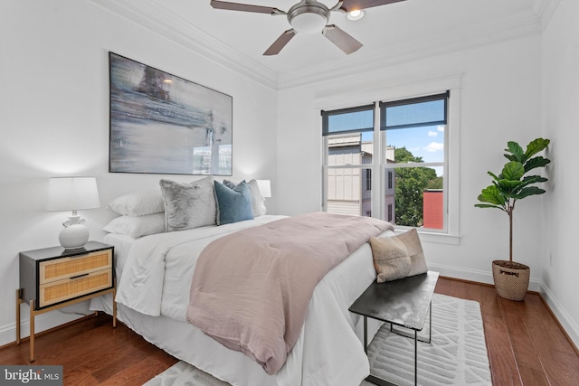 bedroom featuring ceiling fan, crown molding, and dark hardwood / wood-style floors