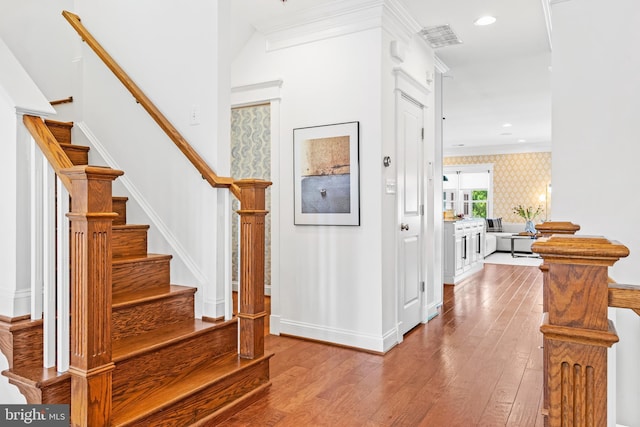 interior space featuring ornamental molding and light hardwood / wood-style flooring