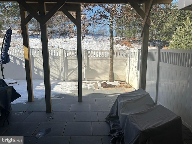 view of snow covered patio