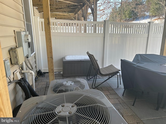 view of patio / terrace featuring central AC unit and a grill