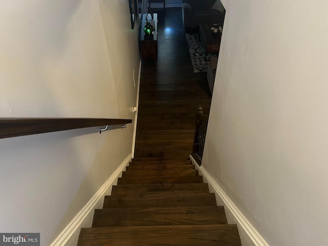 staircase featuring hardwood / wood-style flooring