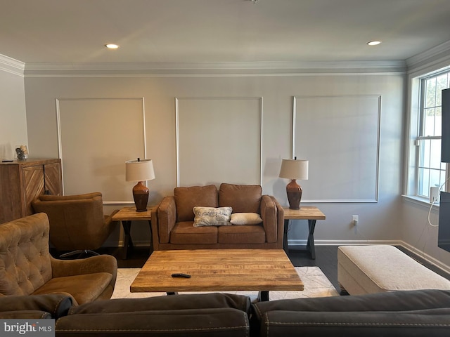 living room with light wood-type flooring and ornamental molding