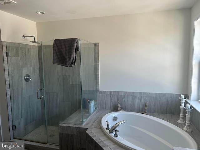 bathroom with independent shower and bath