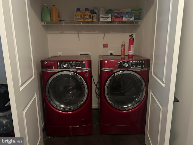 clothes washing area featuring washer and dryer