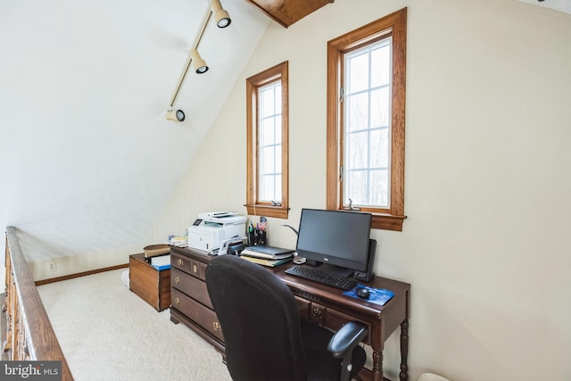 home office with lofted ceiling