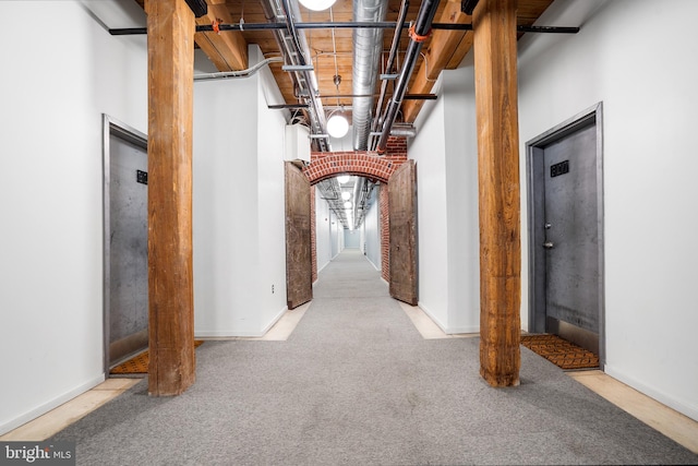 hallway with carpet floors