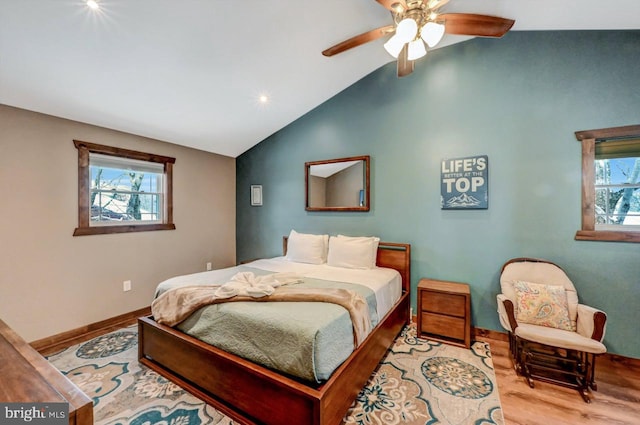 bedroom with vaulted ceiling, ceiling fan, and light hardwood / wood-style floors