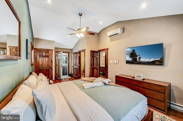 bedroom featuring ensuite bath, hardwood / wood-style flooring, a wall unit AC, vaulted ceiling, and ceiling fan