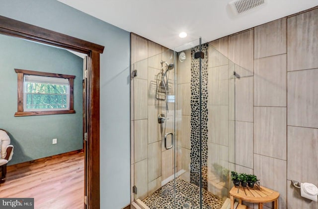 bathroom featuring an enclosed shower