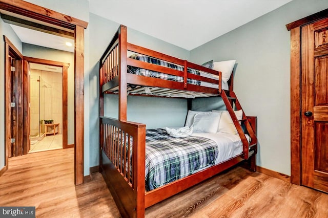 bedroom with light hardwood / wood-style flooring