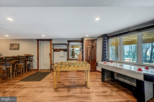 recreation room with light hardwood / wood-style flooring