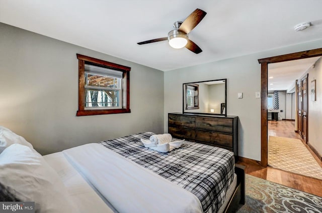 bedroom featuring ceiling fan and hardwood / wood-style flooring