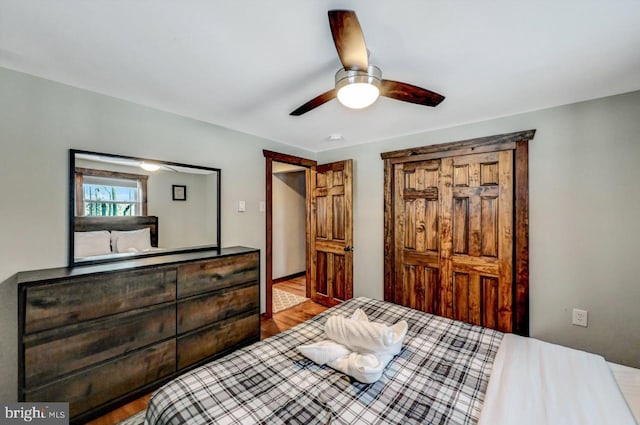 bedroom featuring ceiling fan and hardwood / wood-style flooring