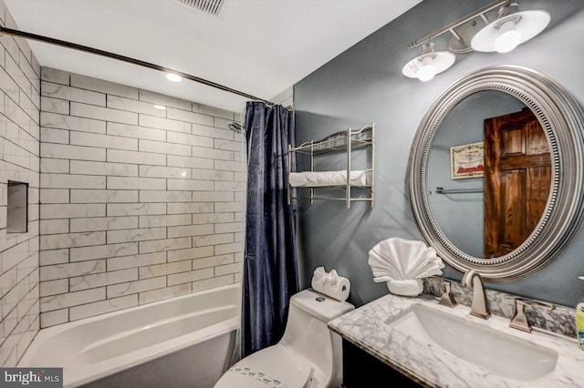 full bathroom with toilet, vanity, and shower / tub combo with curtain