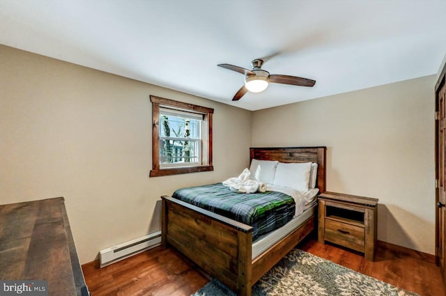 bedroom with ceiling fan, a baseboard radiator, and dark hardwood / wood-style flooring