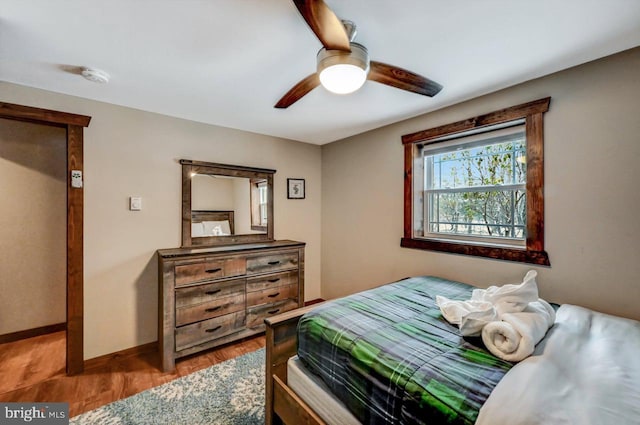 bedroom with ceiling fan and hardwood / wood-style floors