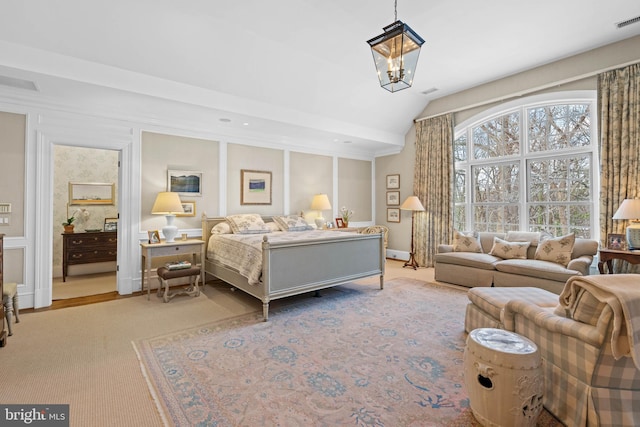 bedroom featuring a chandelier, multiple windows, and vaulted ceiling