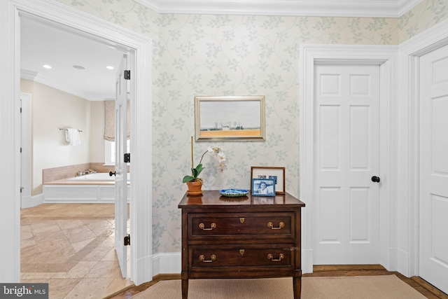 hall featuring ornamental molding