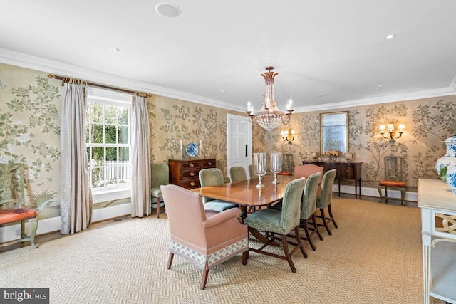 dining area with an inviting chandelier, crown molding, and light carpet