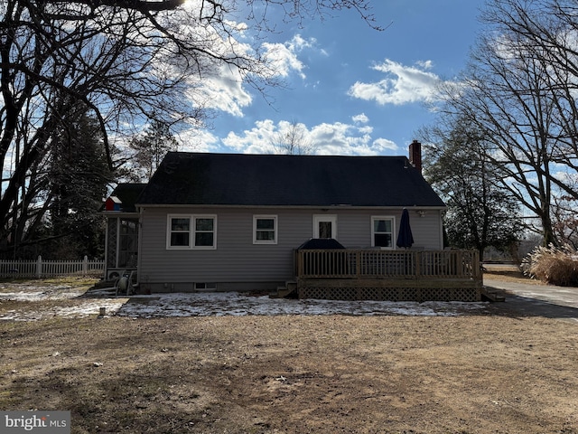 back of house with a wooden deck