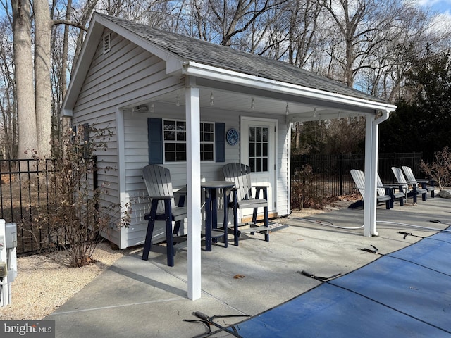 view of patio featuring an outdoor structure