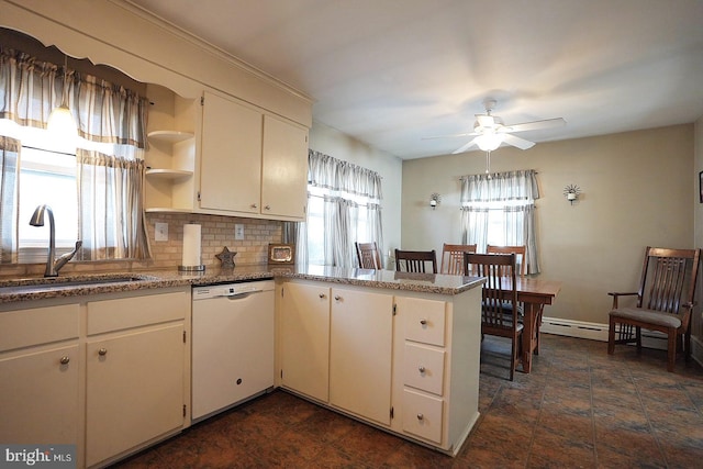 kitchen featuring dishwasher, sink, backsplash, light stone counters, and kitchen peninsula