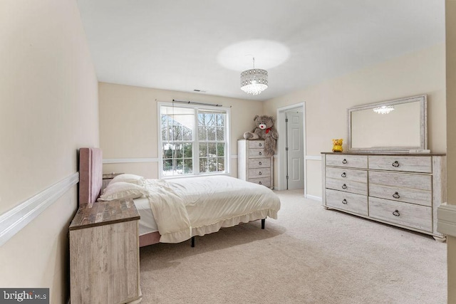 bedroom featuring light colored carpet