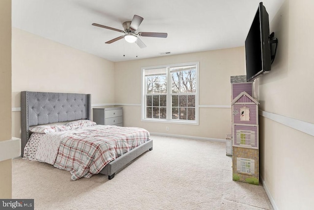 bedroom featuring ceiling fan and carpet