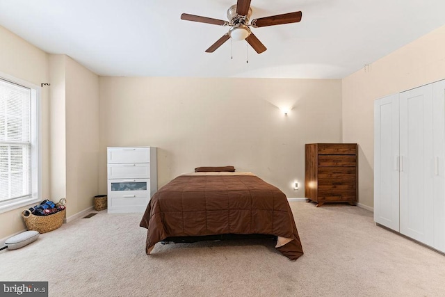 carpeted bedroom featuring ceiling fan