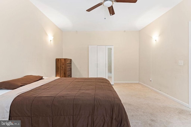 carpeted bedroom featuring ceiling fan