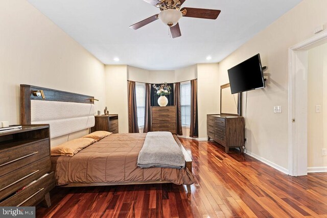 bedroom featuring ceiling fan and dark hardwood / wood-style floors