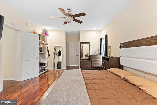 unfurnished bedroom with ceiling fan and hardwood / wood-style floors