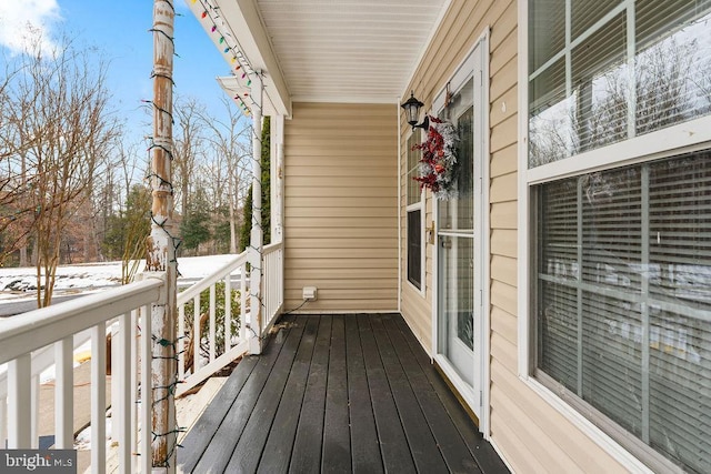 view of snow covered deck