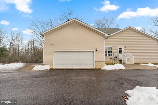 exterior space with a garage