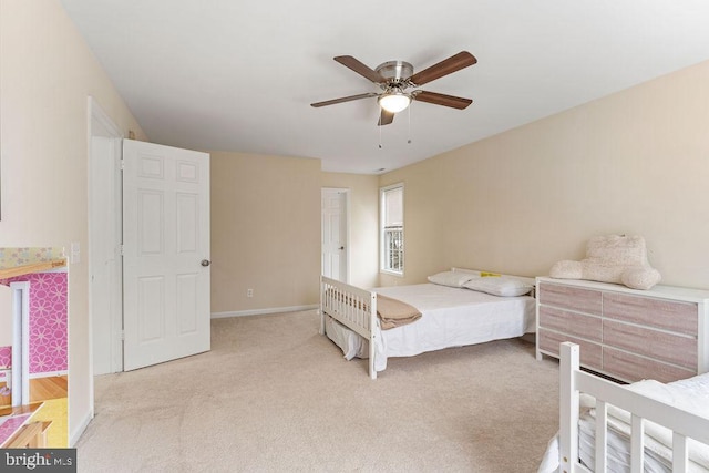 bedroom with ceiling fan and light colored carpet