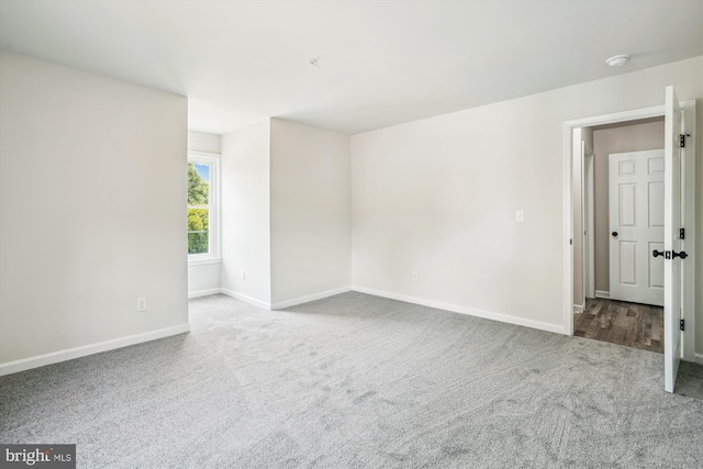 unfurnished room with carpet floors