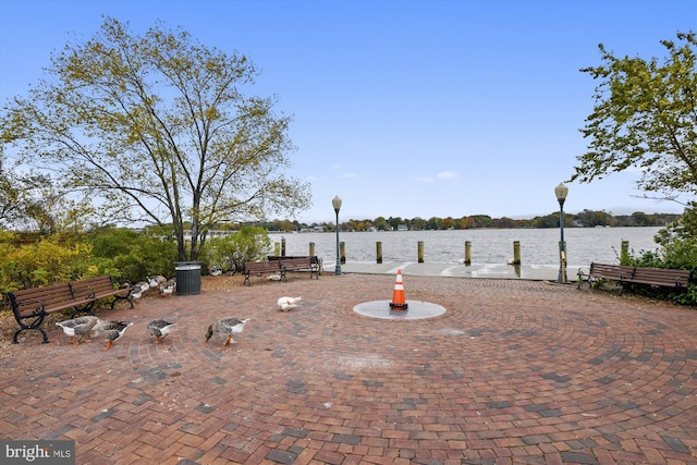 view of patio with a water view