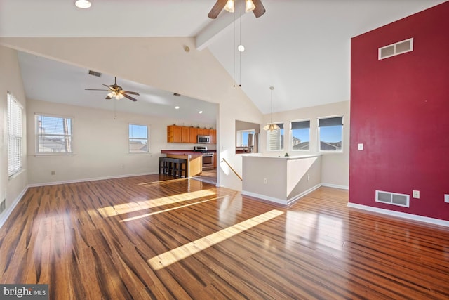 unfurnished living room with high vaulted ceiling, hardwood / wood-style floors, ceiling fan, and beamed ceiling