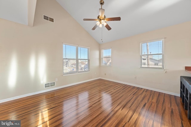 unfurnished room with ceiling fan, hardwood / wood-style floors, and high vaulted ceiling