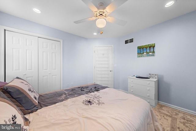 bedroom featuring a closet, ceiling fan, and carpet