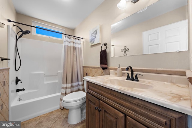 full bathroom featuring toilet, tile patterned flooring, shower / bathtub combination with curtain, and vanity