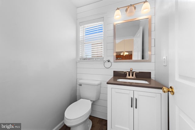 bathroom with toilet and vanity