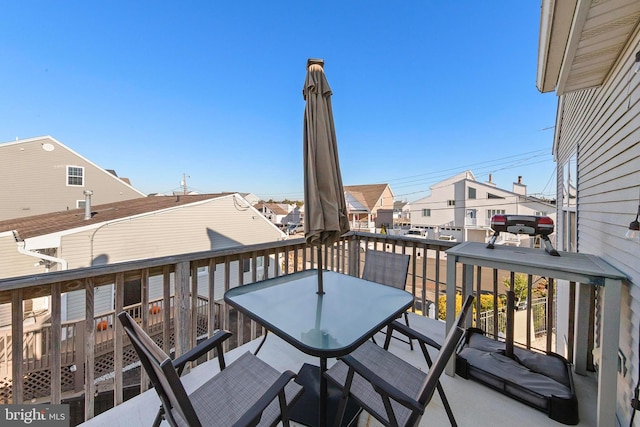 wooden balcony featuring a deck